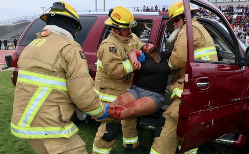 Lemoore's firemen, using the Jaws of Life, remove a victim from a vehicle.